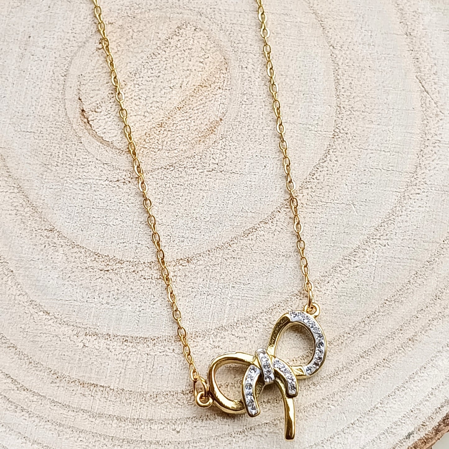 Golden Bow Pendant Necklace with Stone Accents
