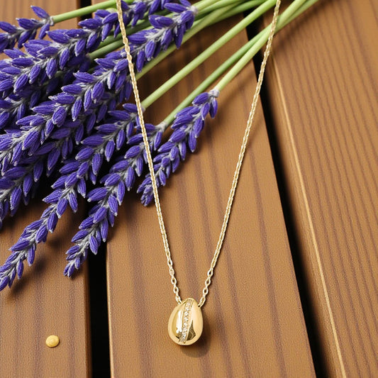 Golden Cowrie Shell Pendant Necklace with Stone Detailing