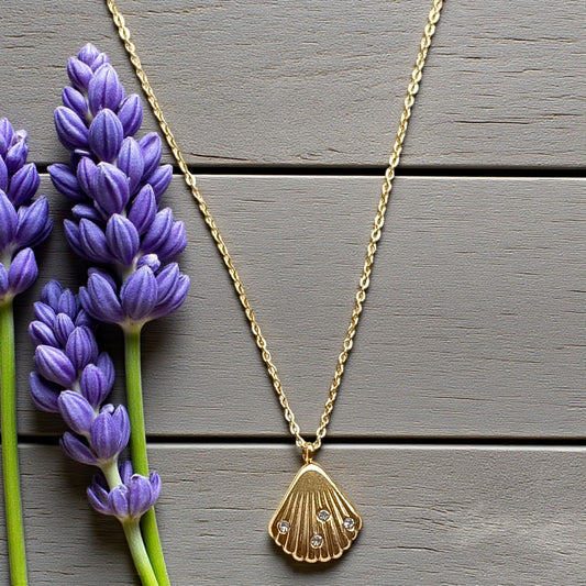Golden Seashell Pendant Necklace with Stone Accents