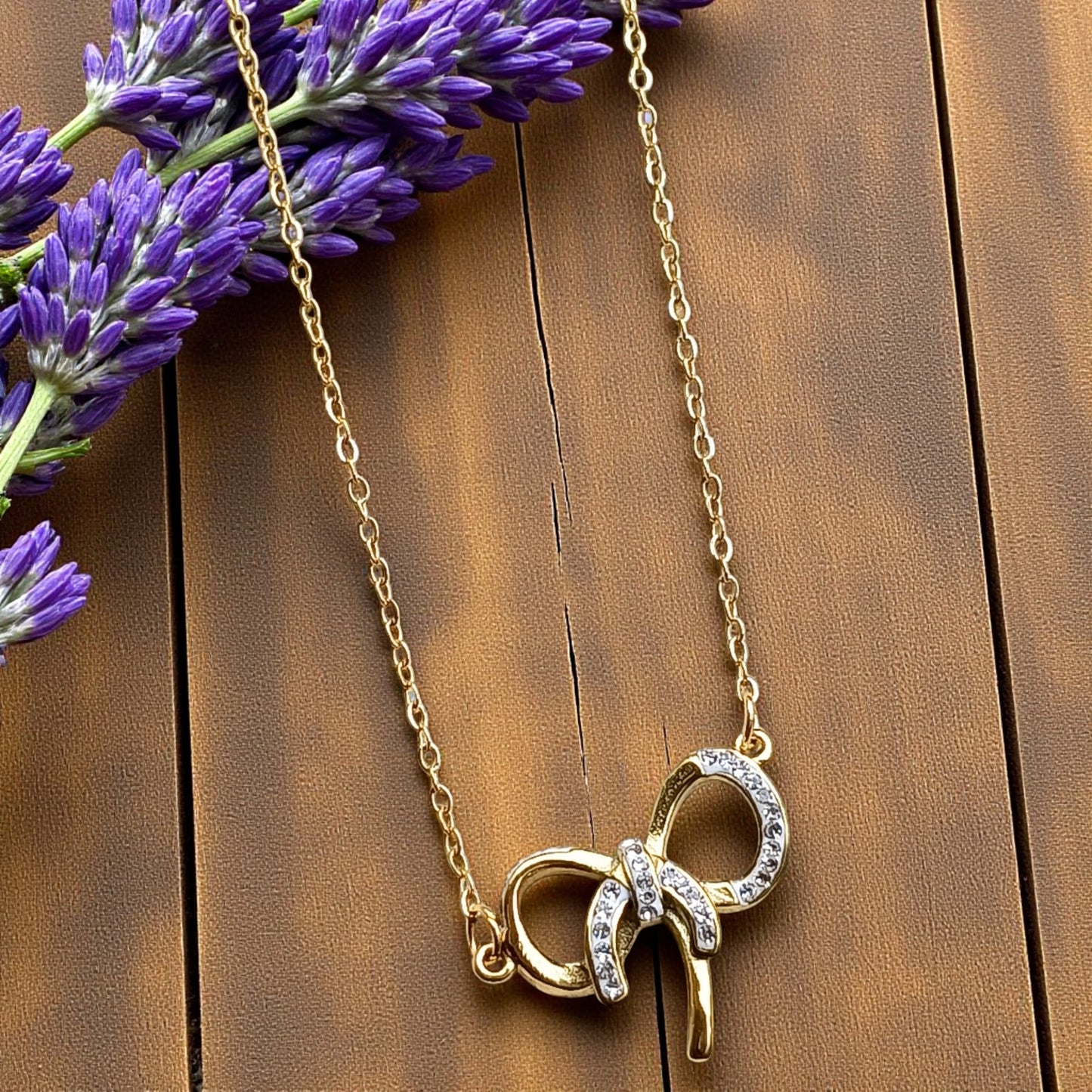 Golden Bow Pendant Necklace with Stone Accents