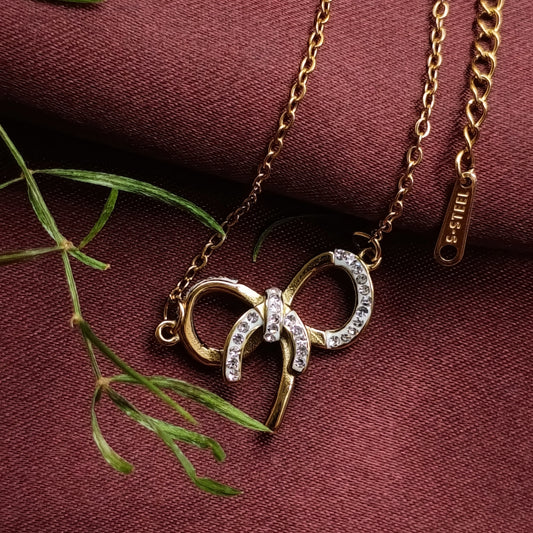 Golden Bow Pendant Necklace with Stone Accents
