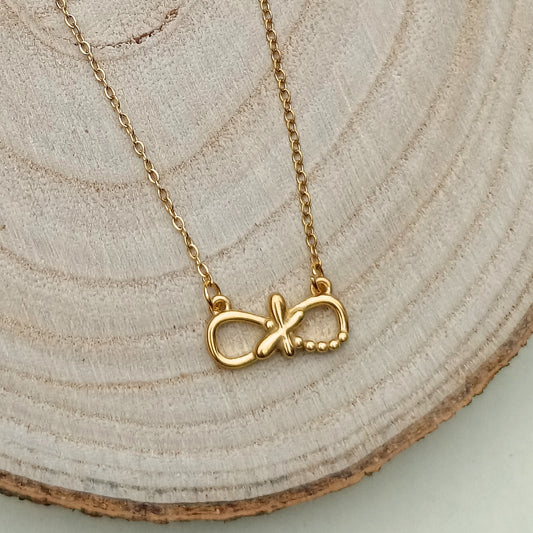 Golden Infinity Pendant Necklace with Cross Accent