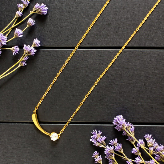 Golden Curved Bar Necklace with Sparkling Stone