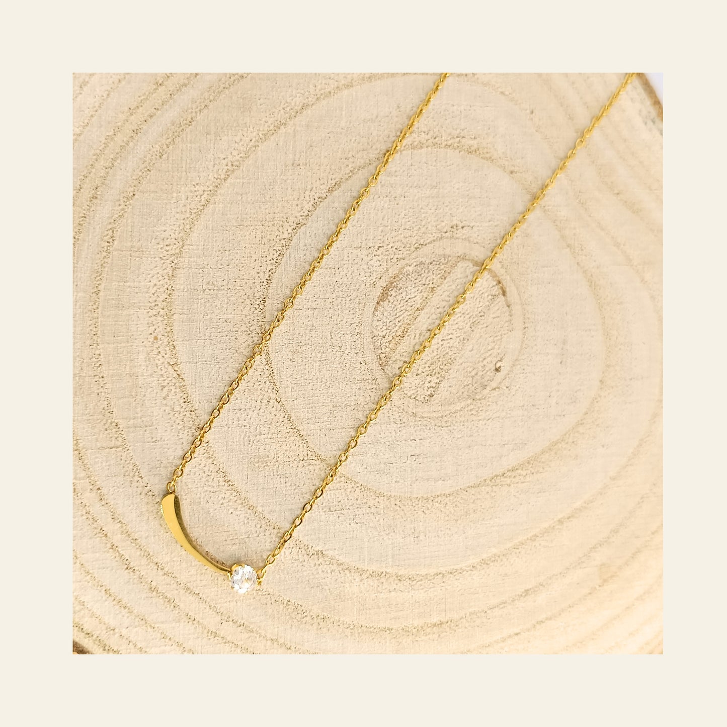 Golden Curved Bar Necklace with Sparkling Stone